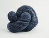 Madelinetosh Tosh DK yarn in rich, variegated shades, showcasing the soft, twisted skein of this popular DK weight yarn.