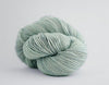 Madelinetosh Tosh DK yarn in Moonglow color, soft hand-dyed wool yarn for knitting and crochet projects.