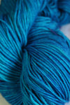 Madelinetosh Tosh DK yarn in vibrant blue color, soft and smooth wool yarn for knitting and crochet projects.