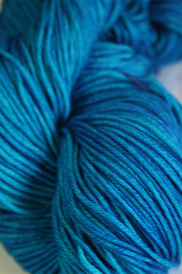Madelinetosh Tosh DK yarn in vibrant blue color, soft and smooth wool yarn for knitting and crochet projects.