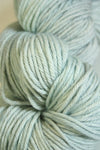 Madelinetosh Tosh DK yarn in Moonglow color, soft and vibrant wool for knitting or crochet projects.