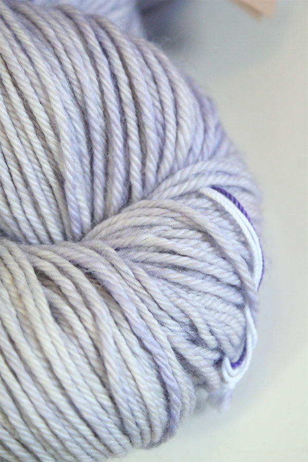 Madelinetosh Tosh DK yarn in Moonstone, soft and vibrant wool yarn for knitting and crochet projects, shown in close-up.