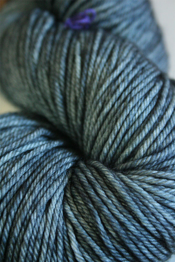 Soft Madelinetosh Tosh DK yarn in Dr Zhivago colorway, showcasing the rich, variegated wool skein with vibrant blue and green tones.