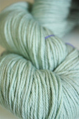 Madelinetosh Tosh DK yarn in Silverleaf color, soft and vibrant wool yarn for knitting and crochet projects.
