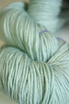 Madelinetosh Tosh DK yarn in Silverleaf color, soft and vibrant wool yarn for knitting and crochet projects.