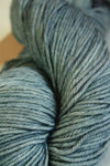Colorful skein of madelinetosh Tosh DK yarn with vibrant variegated shades and soft texture, perfect for knitting or crochet projects.