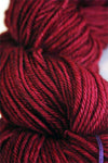 Madelinetosh Tosh DK yarn in a heartbeat colorway, showcasing soft, hand-dyed wool yarn with vibrant tonal variations.