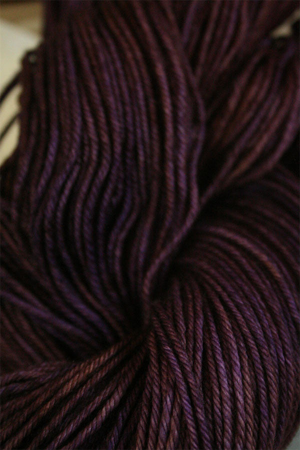 Madelinetosh Tosh DK yarn in Geode colorway, soft wool and silk blend perfect for knitting or crochet projects.