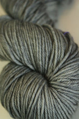 Madelinetosh Tosh DK yarn in Great Grey Owl color, soft and vibrant wool yarn close-up shot.
