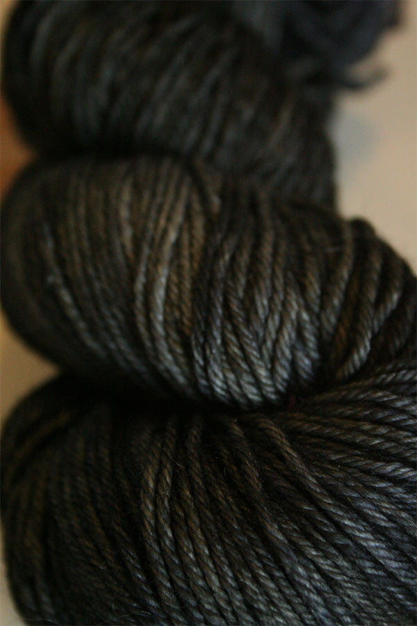Madelinetosh Tosh DK yarn in El Greco colorway, soft and textured wool yarn for knitting or crochet projects.