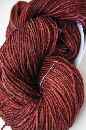 Madelinetosh Tosh DK yarn in Byzantink color, soft wool yarn display with vibrant purple and blue tones.