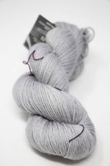 Madelinetosh Tosh DK yarn in Astrid Grey, showing soft, spun wool with a smooth texture and subtle color variation.