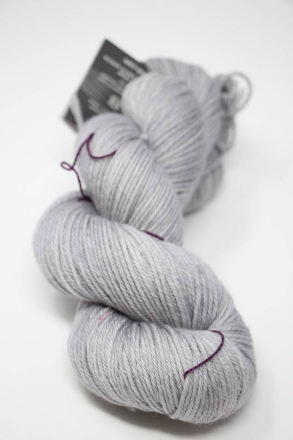 Madelinetosh Tosh DK yarn in Astrid Grey, showing soft, spun wool with a smooth texture and subtle color variation.