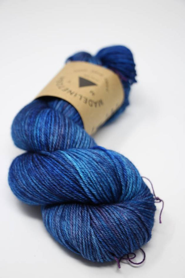 Madelinetosh Tosh DK yarn in Baroque Violet, soft and vibrant wool yarn for knitting or crochet projects.