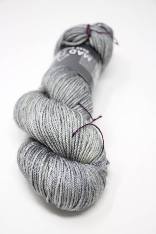 Soft, colorful Madelinetosh Tosh DK yarn in Pelican colorway, showcasing its rich texture and vibrant variegated shades.