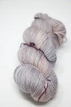 Madelinetosh Tosh DK yarn in Calligraphy colorway, showcasing soft, hand-dyed wool in a close-up image.