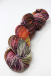 Madelinetosh Tosh DK yarn in Rockey Mountain High colorway, soft wool blend with rich, variegated blue and gray tones.