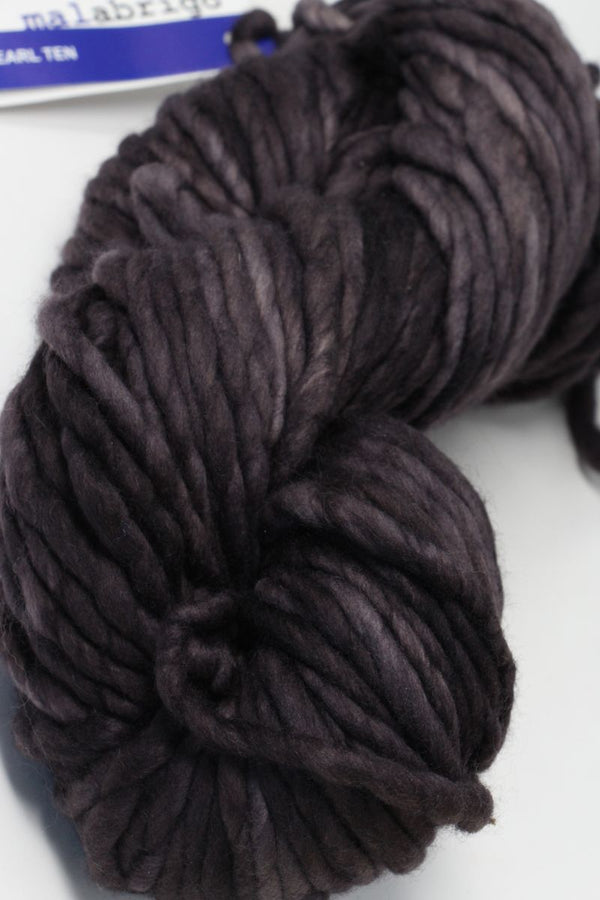 Malabrigo Rasta merino wool yarn in pearl teal, showing thick, soft, textured strands suitable for knitting and crocheting projects.