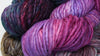 Malabrigo Rasta Merino Wool Yarn in vibrant colors, shown in a group of skeins for knitting or crochet projects.