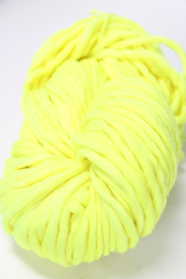 Malabrigo Rasta merino wool yarn in vibrant Fluoro colorway, showing thick, soft textured skein for knitting or crochet projects.