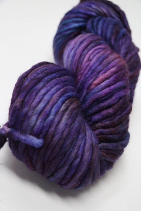 Malabrigo Rasta Merino Wool Yarn in Abril color, showing thick, soft yarn with vibrant pastel shades and a textured appearance.