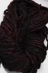 Malabrigo Rasta merino wool yarn in blegianchocolate color, showcasing thick, soft textured yarn for knitting or crochet projects.