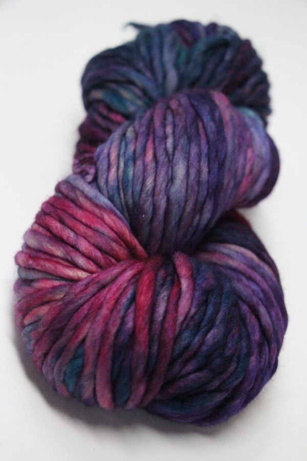 Malabrigo Rasta merino wool yarn in Boreal color, showing thick, soft yarn with vibrant blue and green tones.
