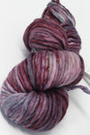 Malabrigo Rasta merino wool yarn in lotus color, showcasing thick, soft, and textured wool skein for knitting and crafting projects.