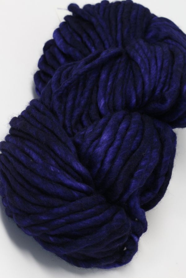 Purple Malabrigo Rasta Merino Wool Yarn skein with soft, thick, and textured fibers perfect for knitting or crochet projects.