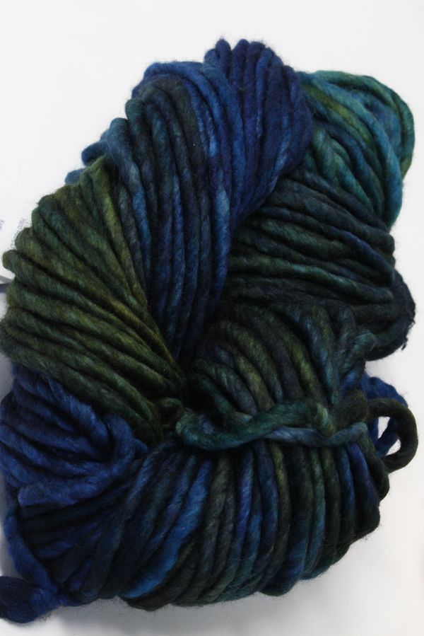 Malabrigo Rasta merino wool yarn in vibrant green and blue hues, showcasing thick, soft, and textured yarn for knitting or crochet projects.
