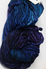 Malabrigo Rasta Merino Wool Yarn in Whales Road color, showing thick, textured yarn with vibrant blue and teal shades.