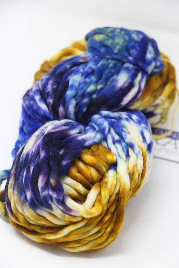 Malabrigo Rasta merino wool yarn in vibrant pensamiento colorway, showcasing thick, soft, hand-dyed wool for knitting or crochet projects.