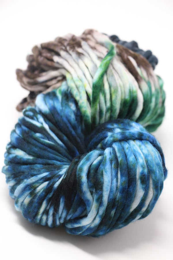 Malabrigo Rasta Merino Wool Yarn in vibrant snake pattern, showcasing thick, soft, and colorful hand-knit-inspired yarn.
