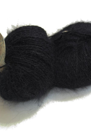 Black Plymouth Angora Yarn displayed in a close-up image showing soft, fluffy texture of the knitting yarn.