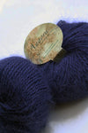 Navy Plymouth Angora Yarn ball, soft and fluffy knitting yarn with angora fibers, ready for crafting and knitting projects.