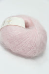 Soft, multicolor Rowan Kidsilk Haze yarn ball in shades of gray and pastel, showcasing its delicate, lightweight texture.