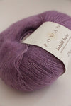 Soft, multicolor Rowan Kidsilk Haze yarn ball with a delicate, fuzzy texture, perfect for knitting or crocheting cozy garments.