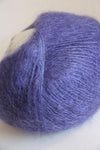 Close-up of Rowan Kidsilk Haze yarn in soft pastel shades, showcasing its delicate, lightweight fiber and smooth texture.