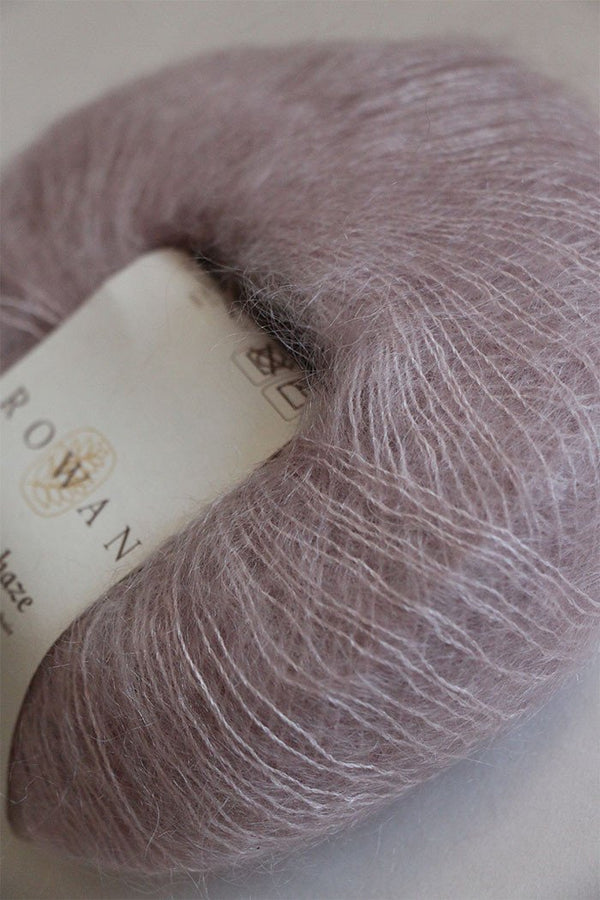 Close-up of Rowan Kidsilk Haze yarn in soft shadow color, showing its delicate, lightweight texture and silky fiber blend.