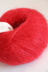 Rowan Kidsilk Haze yarn in rich red color, soft and lightweight fiber ideal for knitting or crochet projects.