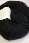 Close-up of Rowan Kidsilk Haze yarn in soft, multicolored strands, showcasing its delicate, lightweight texture.