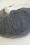 Soft, lightweight Rowan Kidsilk Haze yarn in a smoky gray color, perfect for knitting delicate scarves and shawls.