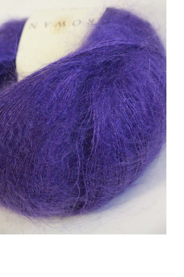 Soft, colorful skeins of Rowan Kidsilk Haze yarn in velvet shades, showcasing the delicate, lightweight fiber for knitting or crochet projects.