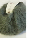 Rowan Kidsilk Haze yarn in drab color, close-up of soft, fine silk and mohair blend suitable for knitting or crochet projects.