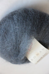 Rowan Kidsilk Haze yarn in anthracite color, soft and lightweight wool and silk blend for knitting or crochet projects.