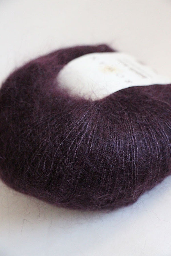 Black Currant Rowan Kidsilk Haze yarn ball showcasing soft, lightweight, multi-purpose knitting and crochet silk and mohair blend.