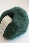Soft, forest green Rowan Kidsilk Haze yarn ball showcasing its delicate, lightweight silk and mohair blend texture.