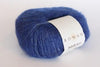 Soft, multicolored Rowan Kidsilk Haze yarn ball showing its fine, lightweight texture and vibrant color blend.