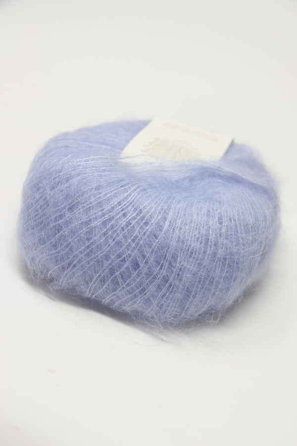 Soft close-up of Rowan Kidsilk Haze yarn in Serenity color, showcasing its delicate, lightweight texture and shimmering silk blend.
