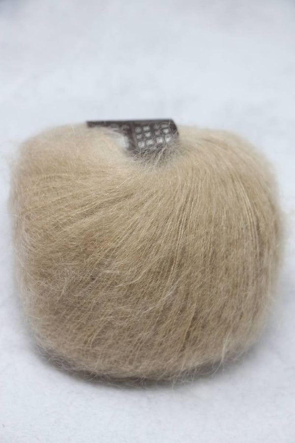 Soft, shimmering Rowan Kidsilk Haze yarn in a lustrous, delicate fiber with subtle color variations for knitting or crochet projects.